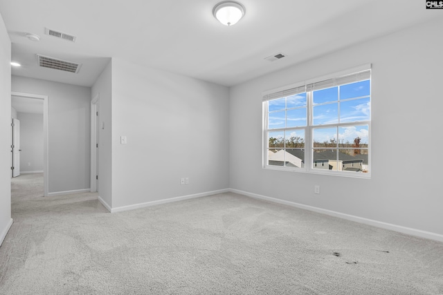 unfurnished room with light colored carpet