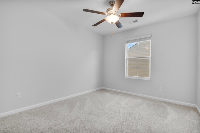 spare room with carpet and ceiling fan