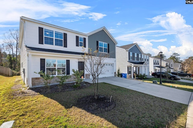 view of front of property featuring a garage and a front lawn