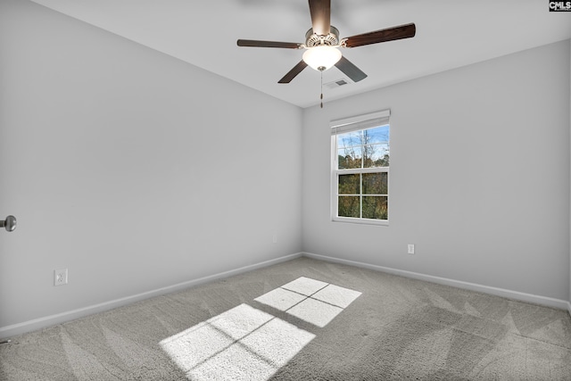 spare room featuring carpet flooring and ceiling fan