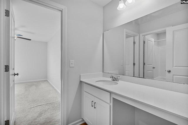 bathroom featuring ceiling fan and vanity