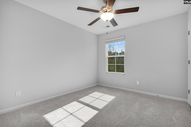 unfurnished room with ceiling fan and light carpet