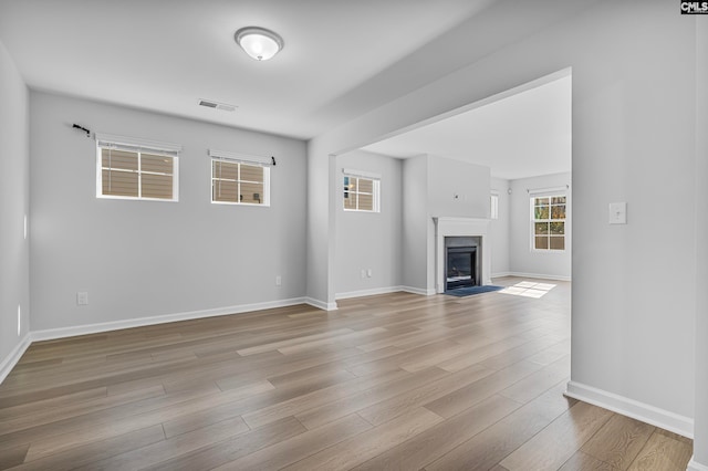 unfurnished living room featuring light hardwood / wood-style floors