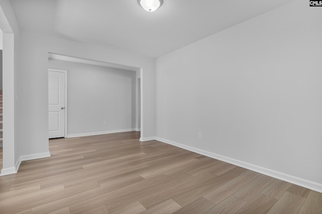 spare room with light hardwood / wood-style flooring