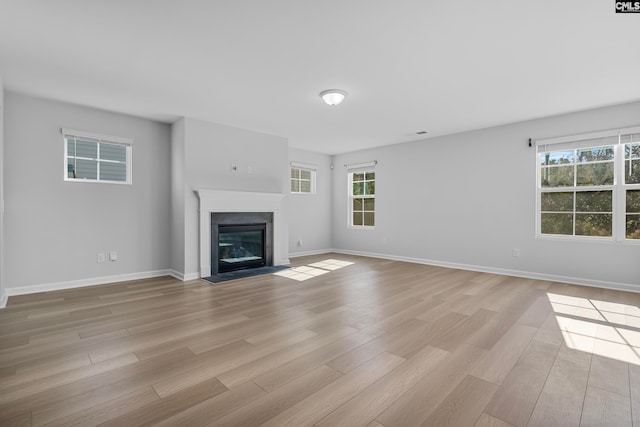 unfurnished living room featuring light hardwood / wood-style flooring