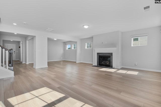 unfurnished living room with light wood-type flooring