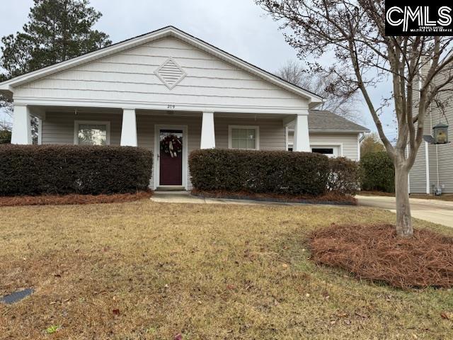 view of front of home with a front yard