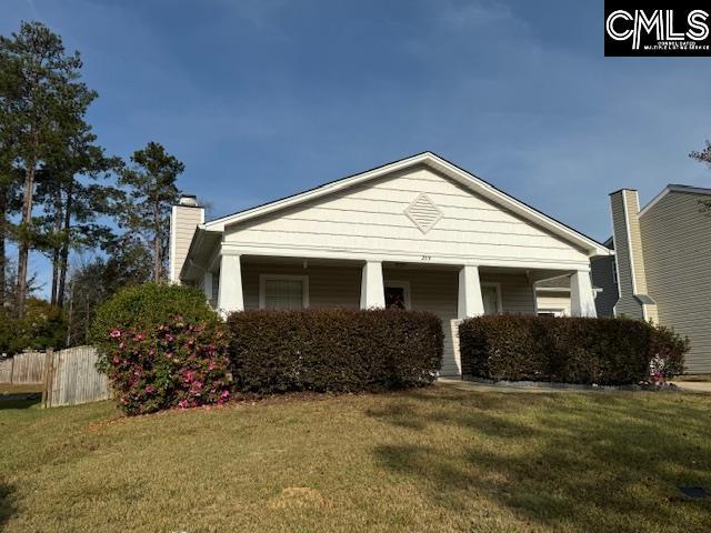 view of front of house with a porch and a front lawn