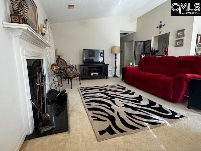 living room featuring a fireplace, carpet, and lofted ceiling