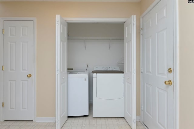 clothes washing area featuring washing machine and clothes dryer