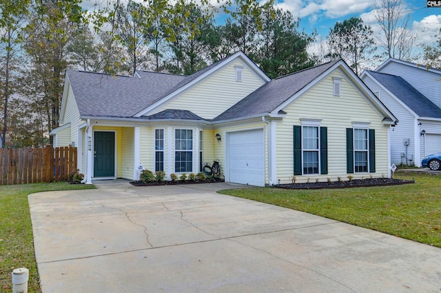 view of front of house with a garage and a front yard