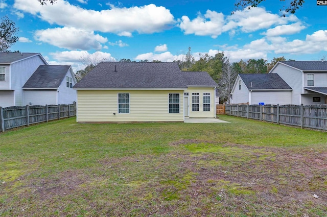 back of property featuring a patio and a lawn