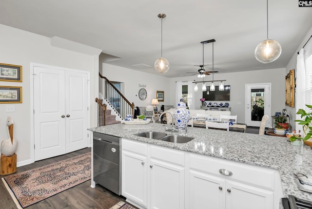 kitchen with ceiling fan, dishwasher, sink, hanging light fixtures, and white cabinets