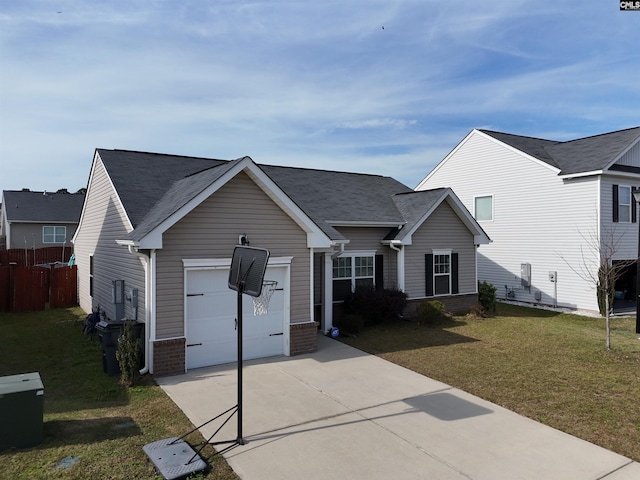 view of front of home featuring a front yard and a garage