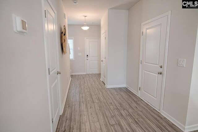 hall featuring light wood-type flooring