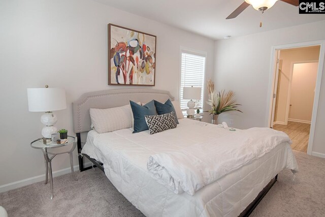 bedroom with ceiling fan and carpet floors