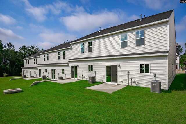 back of property featuring a yard, a patio, and central air condition unit