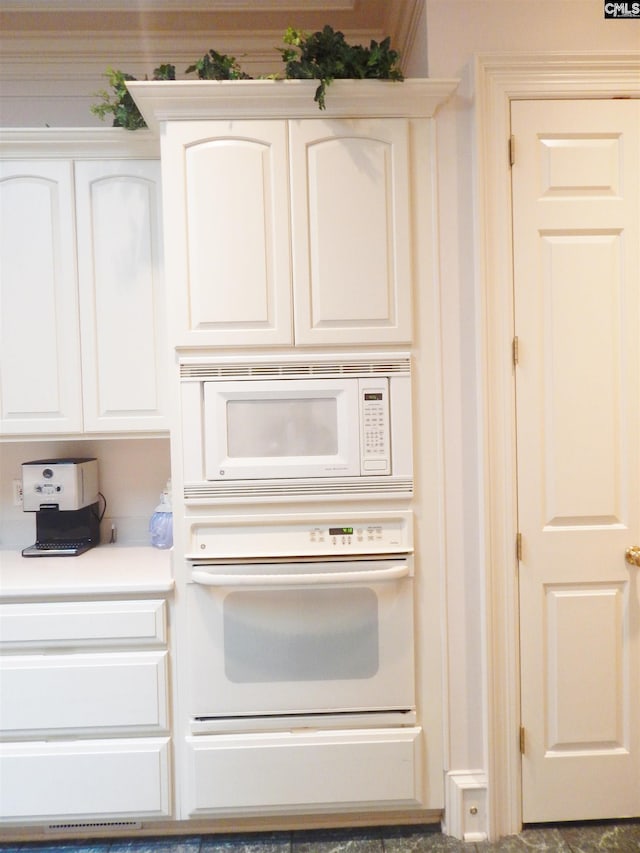 details with white cabinets and white appliances