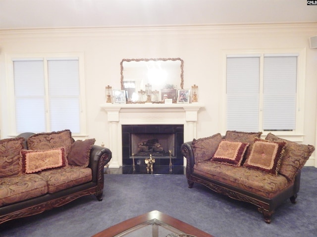 living room with carpet floors, a fireplace, and ornamental molding