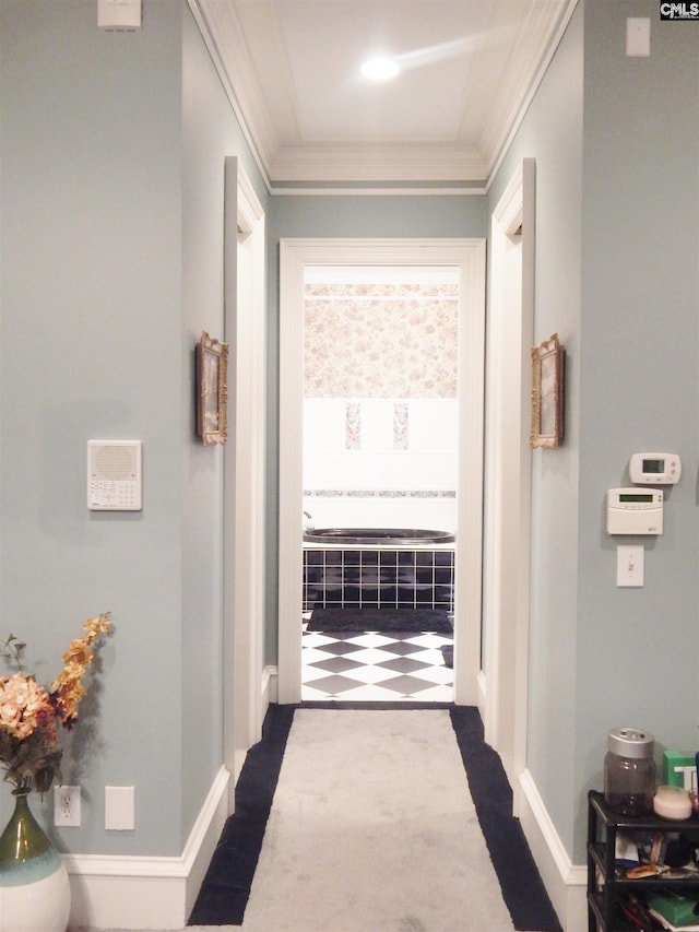 hall featuring dark carpet and ornamental molding