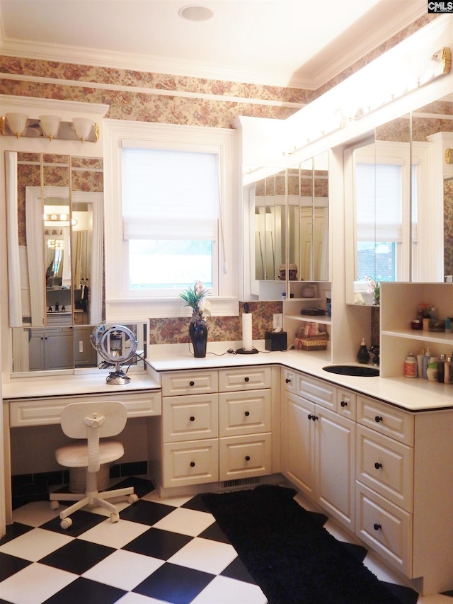 bathroom featuring vanity, a healthy amount of sunlight, and ornamental molding