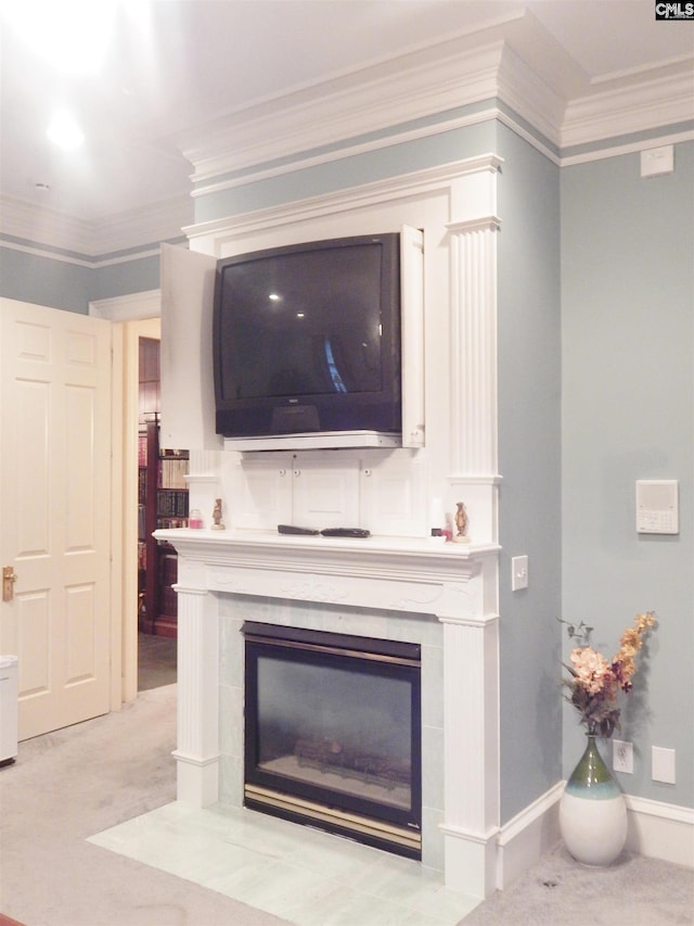 room details with carpet flooring, crown molding, and a tiled fireplace