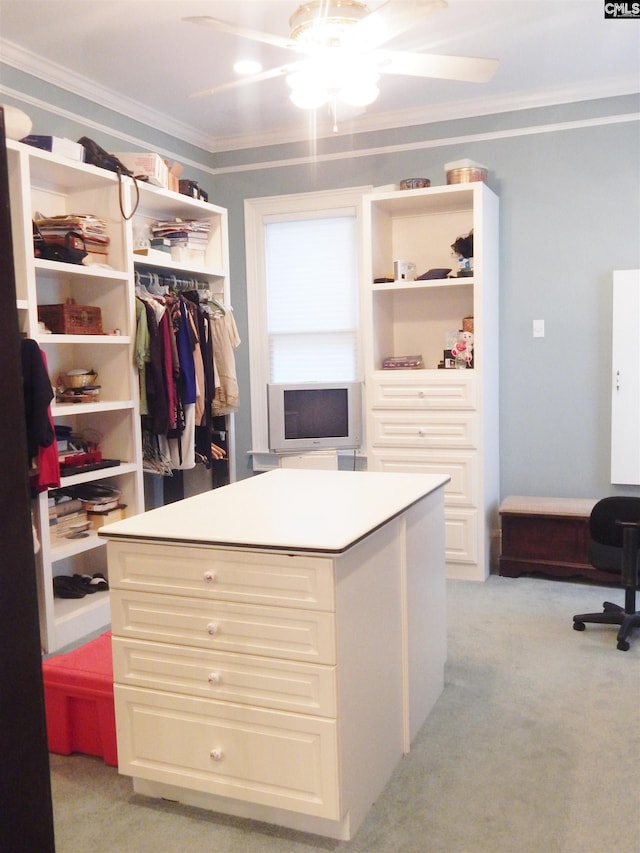 walk in closet featuring light carpet and ceiling fan