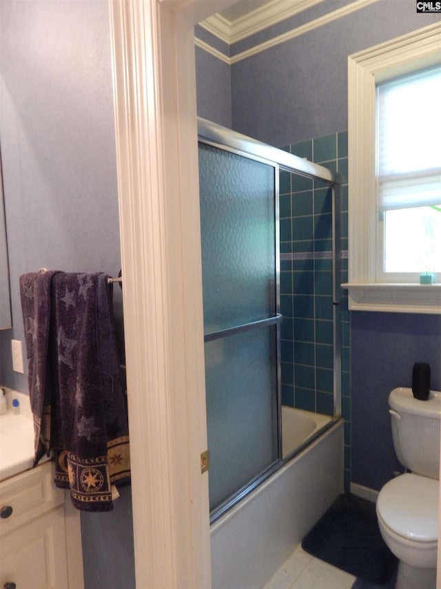 bathroom featuring crown molding, enclosed tub / shower combo, and toilet