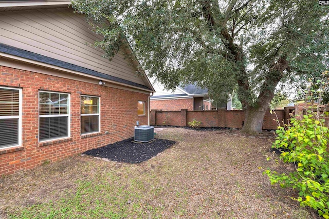 view of yard featuring central AC unit