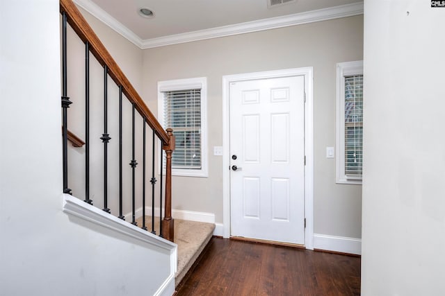 entryway featuring dark hardwood / wood-style floors and crown molding