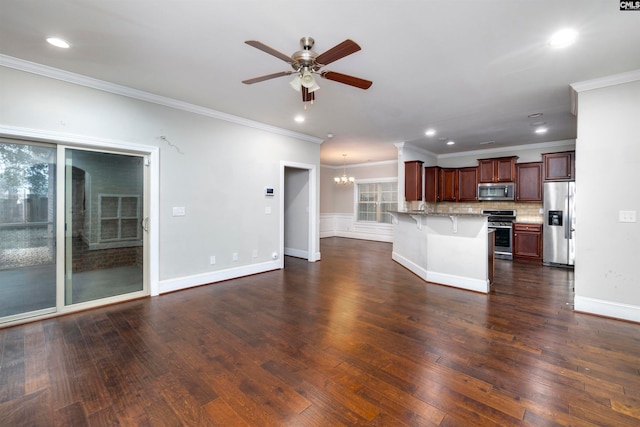 kitchen with a breakfast bar, decorative backsplash, ornamental molding, appliances with stainless steel finishes, and dark hardwood / wood-style flooring