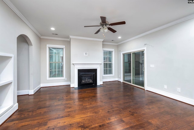 unfurnished living room featuring ceiling fan, dark hardwood / wood-style flooring, and ornamental molding