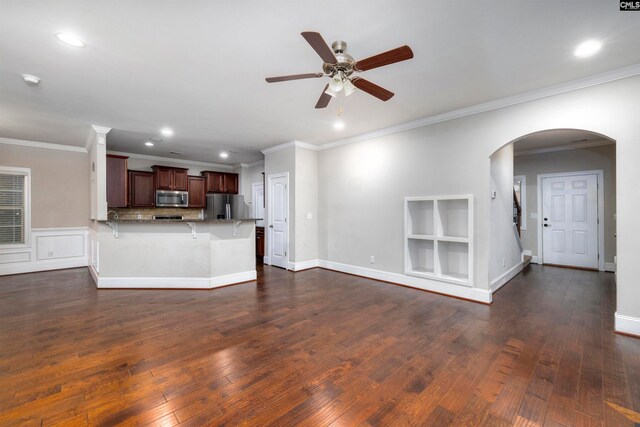 unfurnished living room featuring crown molding, ceiling fan, and dark wood-type flooring