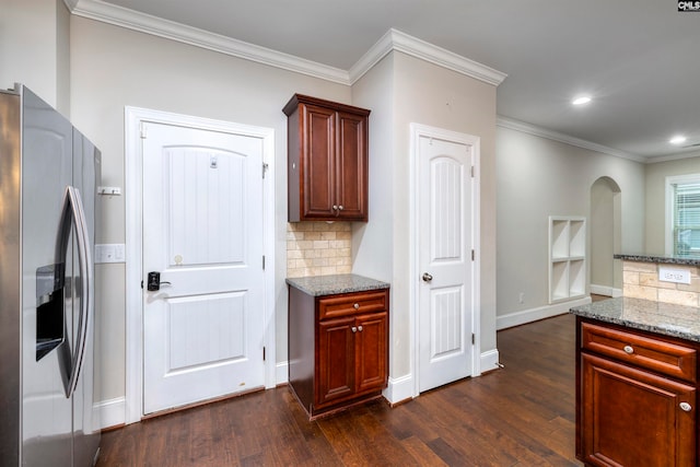 kitchen with stone counters, stainless steel fridge with ice dispenser, dark hardwood / wood-style flooring, and backsplash