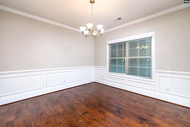 unfurnished room with wood-type flooring, a notable chandelier, and ornamental molding