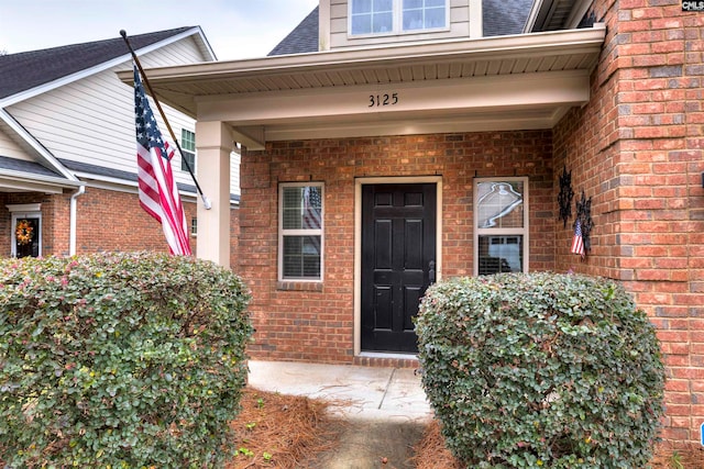 doorway to property featuring covered porch