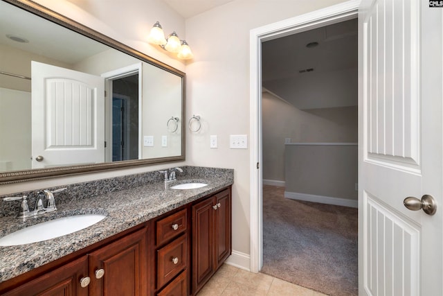 bathroom featuring tile patterned flooring and vanity