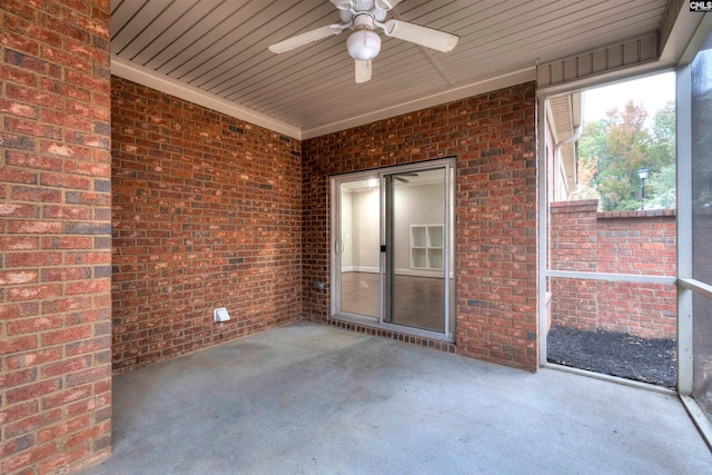 unfurnished sunroom with ceiling fan and wood ceiling