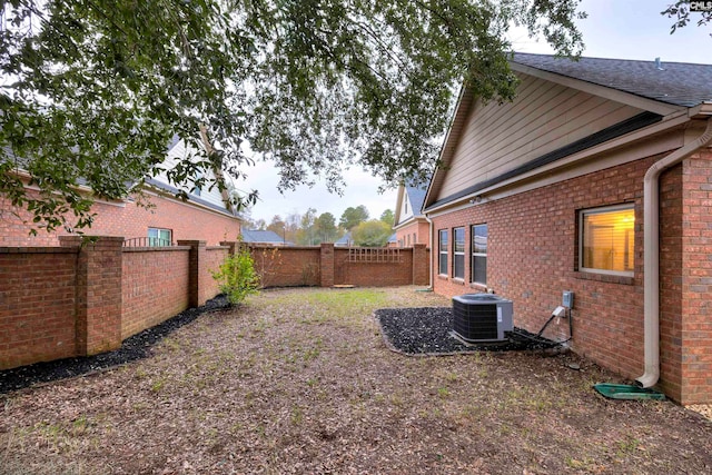 view of yard featuring central AC unit