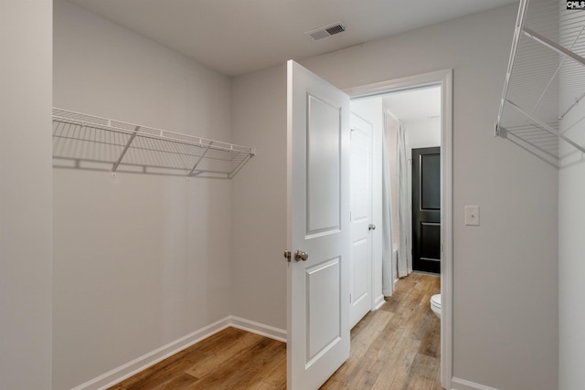 walk in closet featuring light wood-type flooring