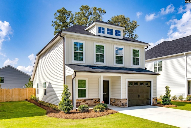 view of front of house with a garage and a front yard