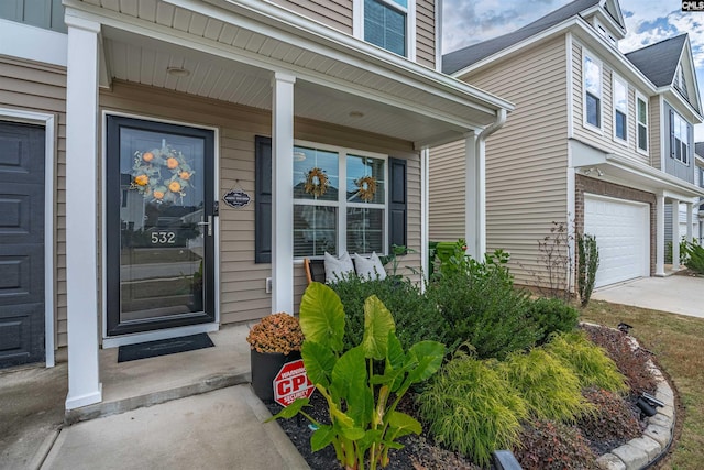 view of exterior entry with a garage