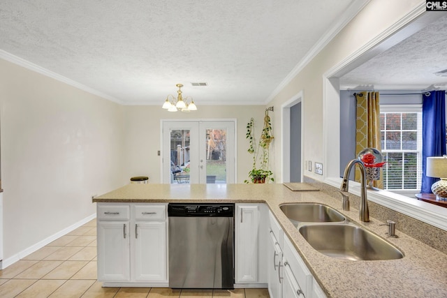 kitchen with sink, white cabinets, stainless steel dishwasher, and a textured ceiling