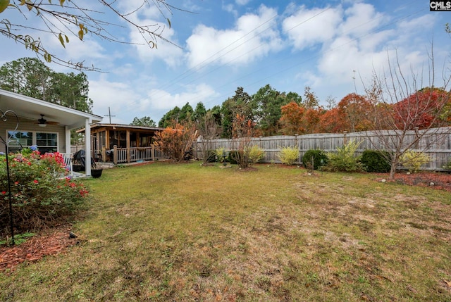 view of yard with ceiling fan