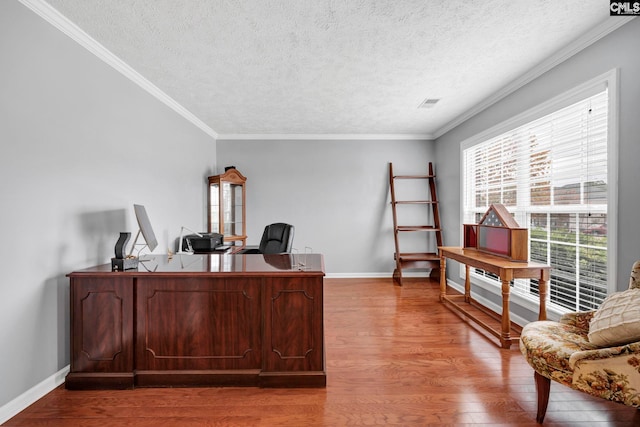 office with a textured ceiling, hardwood / wood-style flooring, and crown molding