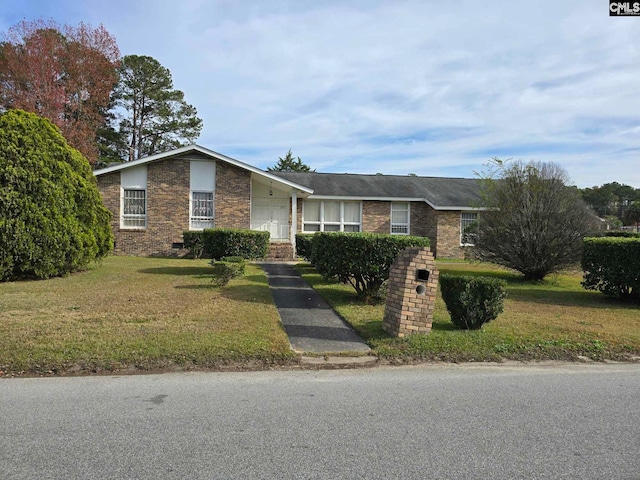 ranch-style home with a front yard