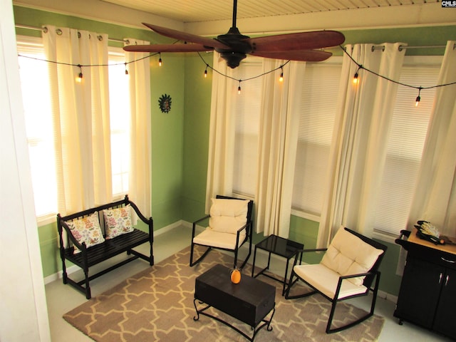 sitting room with ceiling fan and wooden ceiling