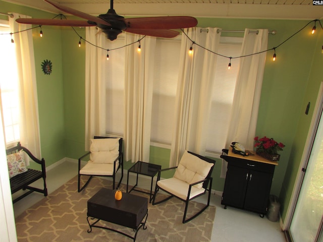 sitting room featuring ceiling fan