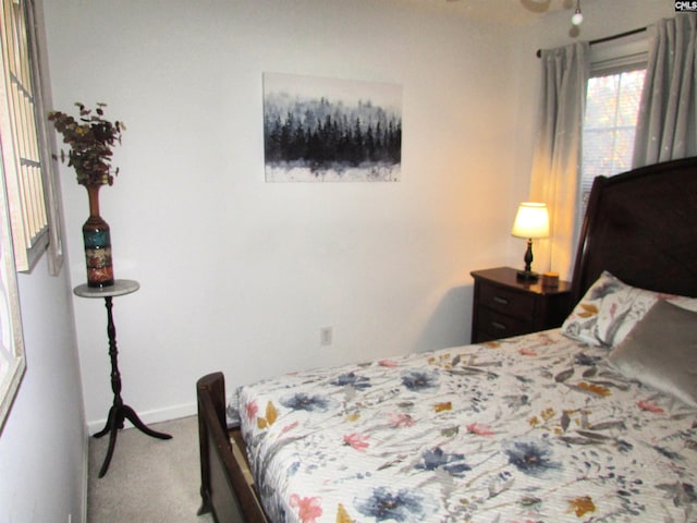 bedroom featuring light colored carpet