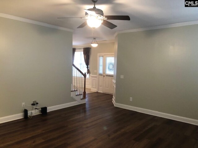 346 Arbor Oaks Ln, Irmo, SC 29063 - unfurnished room featuring dark wood-type flooring, a ceiling fan, crown molding, baseboards, and stairs